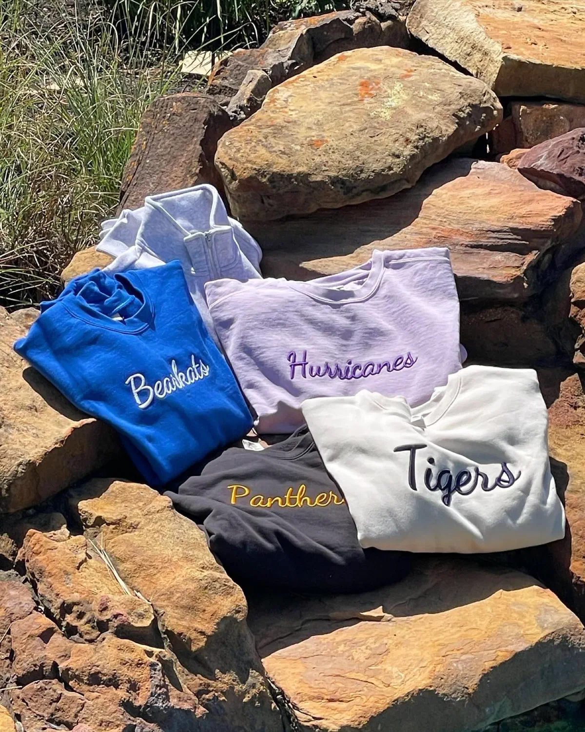 Sports team shirts being monogrammed